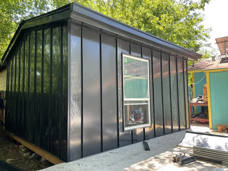 Black standing seam metal wall panels for Roof Inspection in Gardiner